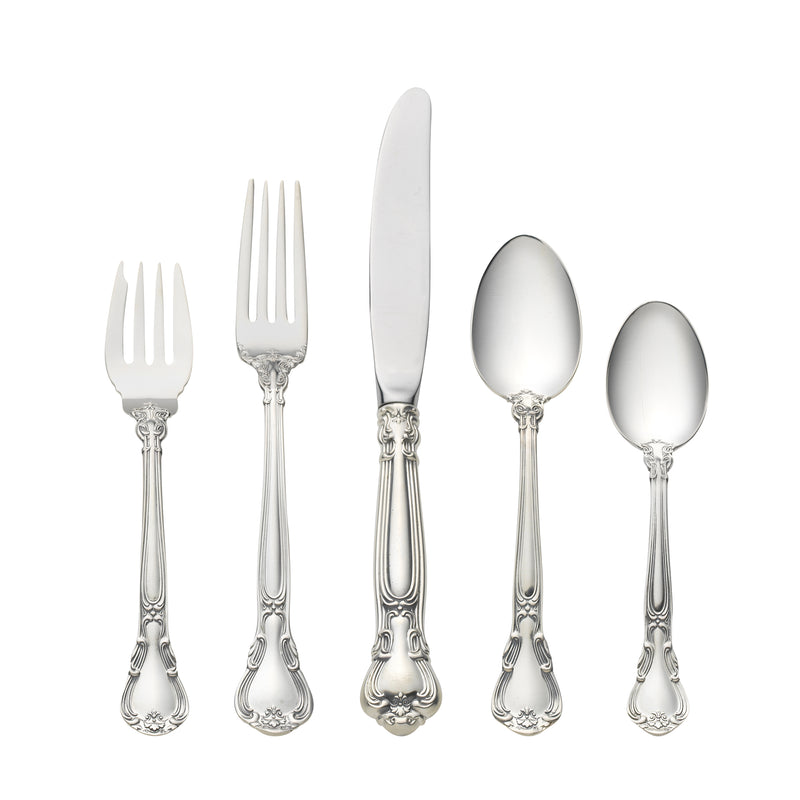 Sterling silver flatware set with decorative handles: forks, knife, and spoons