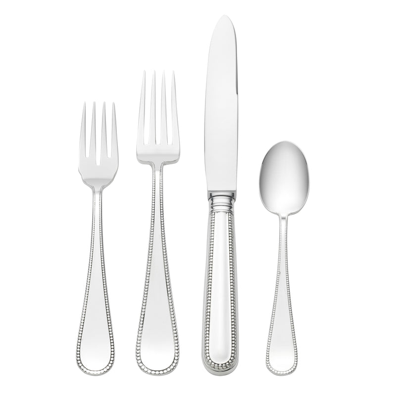 Sterling silver dinner flatware set with fork, knife, and spoon, polished
