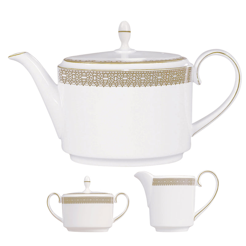 Porcelain teapot and two cups with gold lace trim band and loop handles