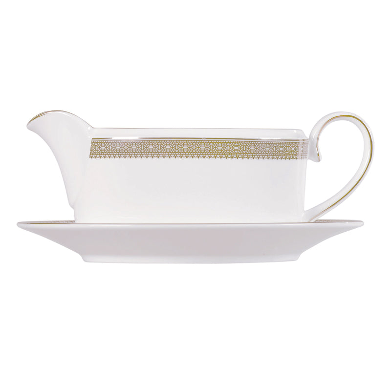 White porcelain gravy boat with gold lace band and matching stand