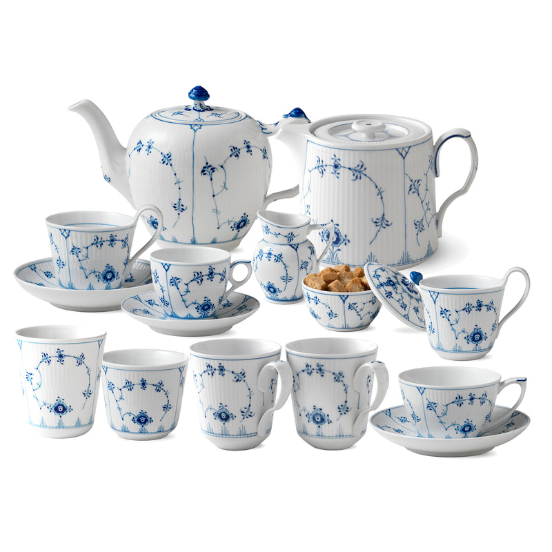 Royal Copenhagen blue fluted porcelain tea service set with teapot, cups, and saucers