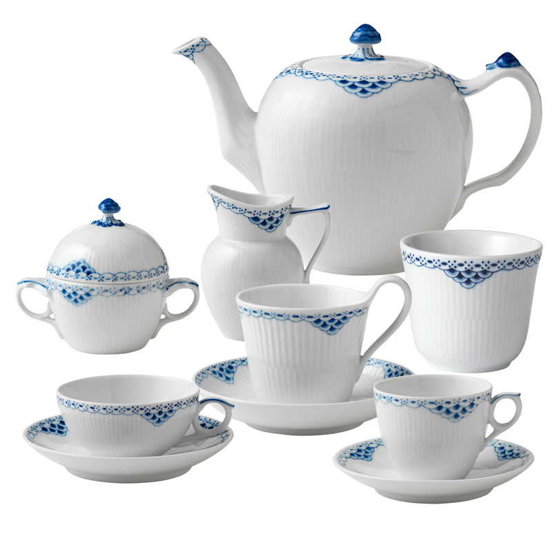 Porcelain tea service set with blue floral trim: teapot, cups, and saucers.