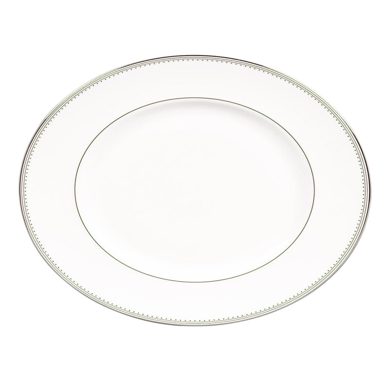 Oval ceramic platter with grosgrain border and green dot trim
