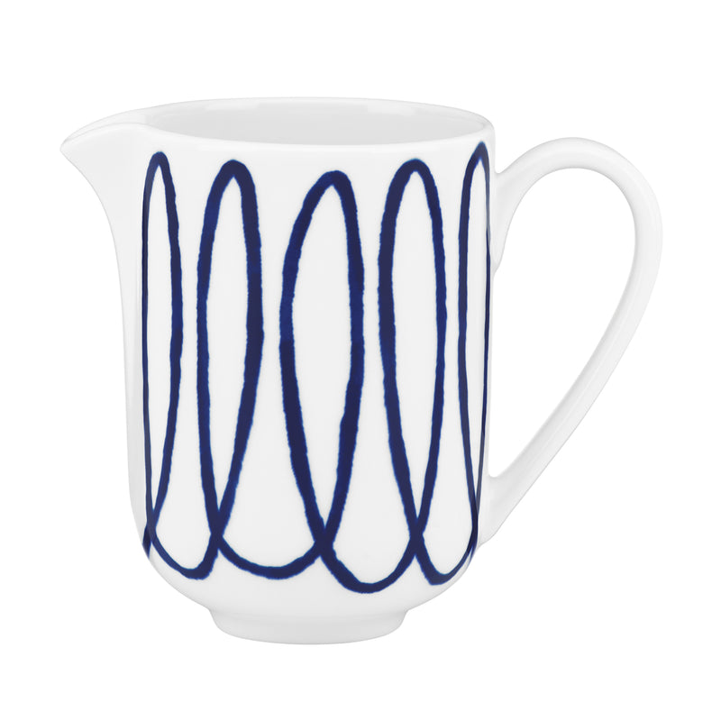 White ceramic creamer pitcher with blue script stripe design and curved handle