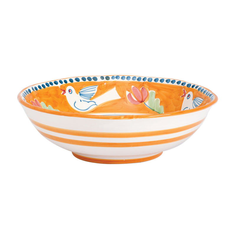 Large serving bowl with orange stripes, bird and floral pattern on white ceramic