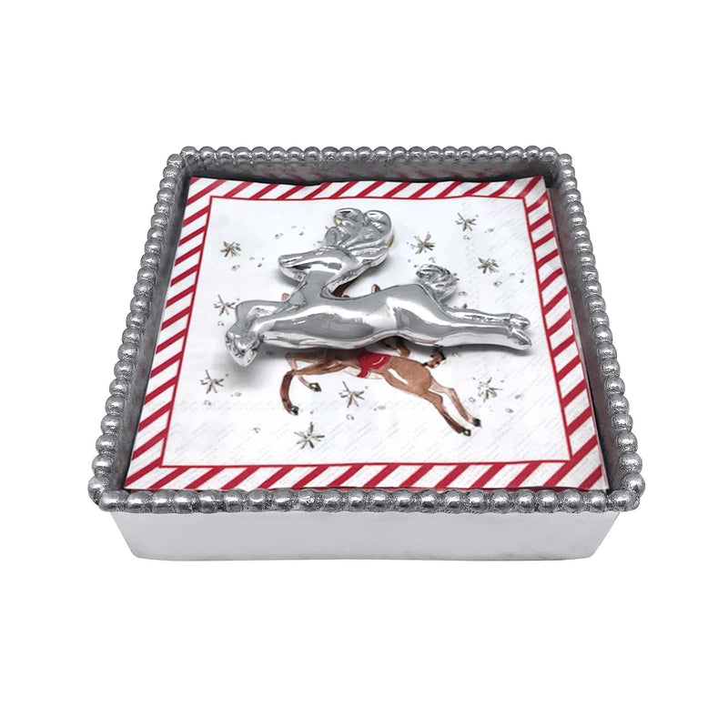 Beaded napkin box with leaping silver reindeer motif and red striped border