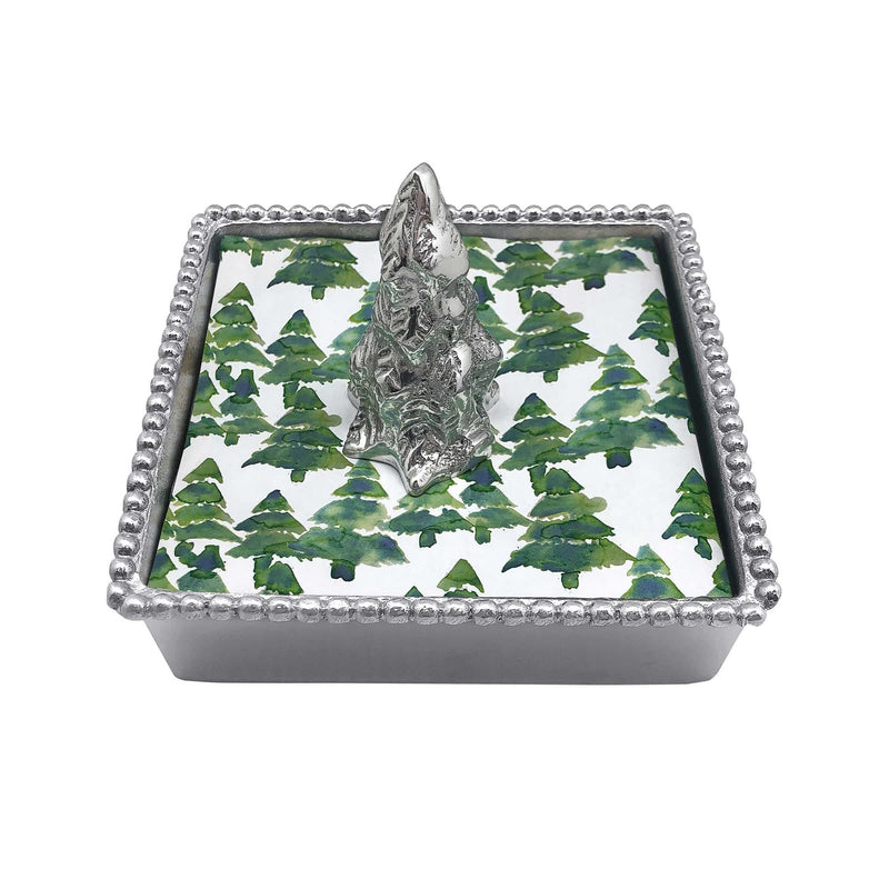 Beaded napkin box with silver border, green leaf liner, and raised evergreen tree topper