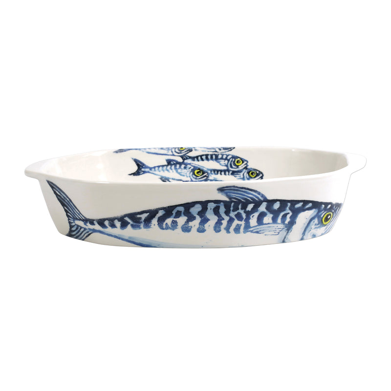 Oval ceramic baking dish with blue fish pattern on white glaze