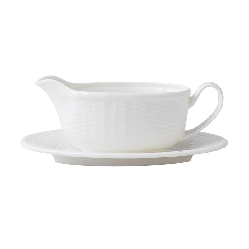 Wedgwood Nantucket Basket porcelain gravy boat with curved handle and matching saucer