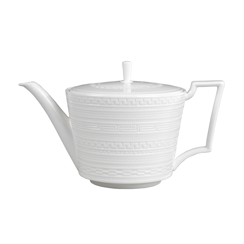 Wedgwood Intaglio white ceramic teapot with lid, curved handle, and long spout