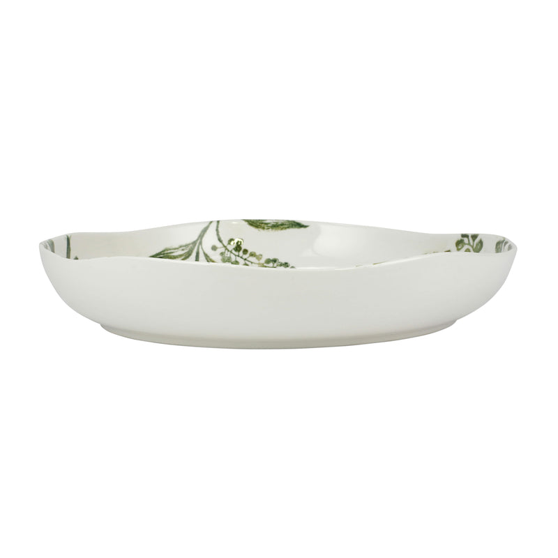 Shallow serving bowl with white base and green botanical pattern around rim