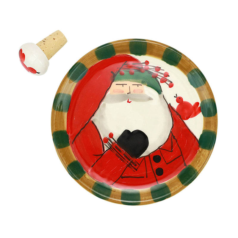 Round decorative canape plate with Santa face and green-and-gold plaid border, with cork stopper