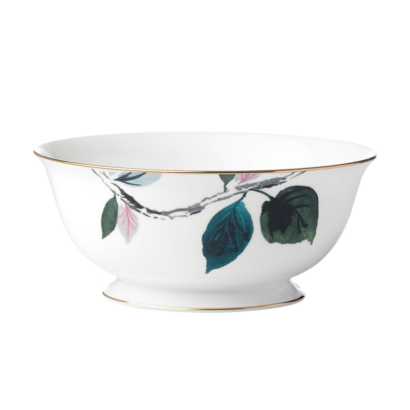 Serving bowl with white base, green floral leaf pattern, and gold rim detail