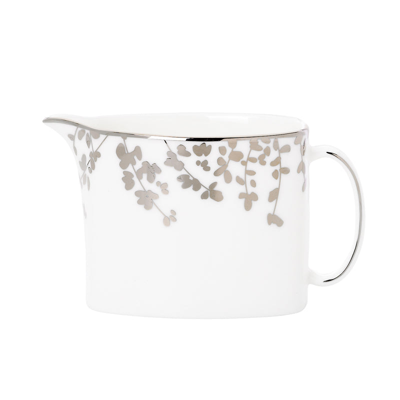 Ceramic creamer pitcher in white with gray floral vine pattern and curved handle