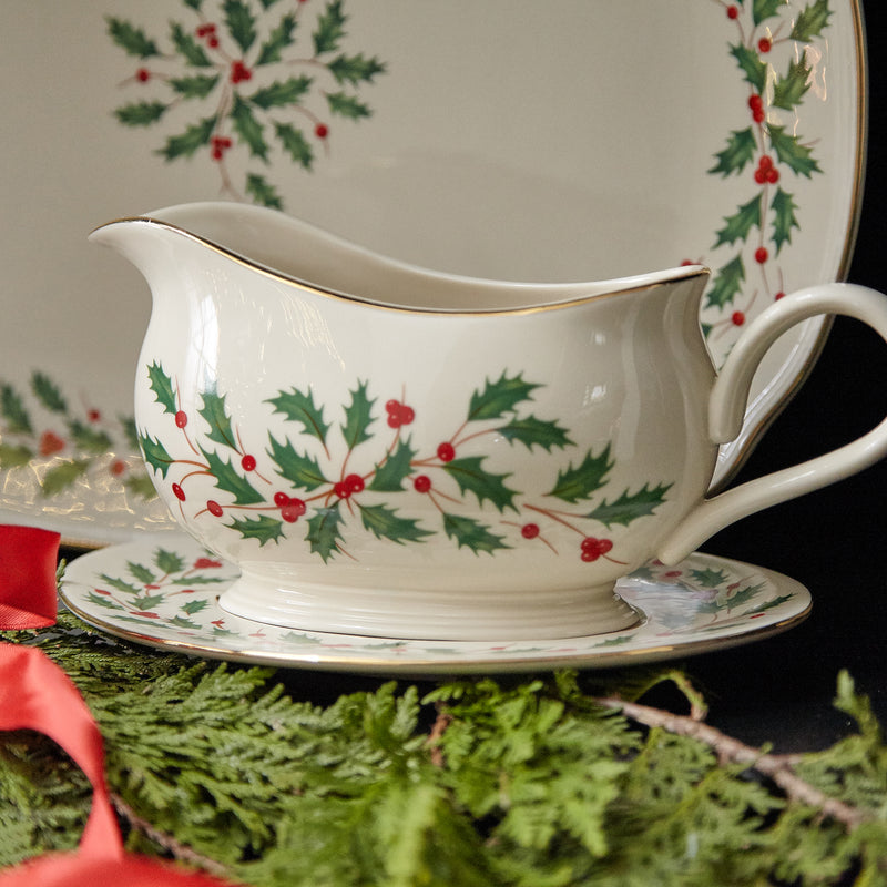 Lenox holiday gravy boat with stand, white ceramic with holly and gold trim