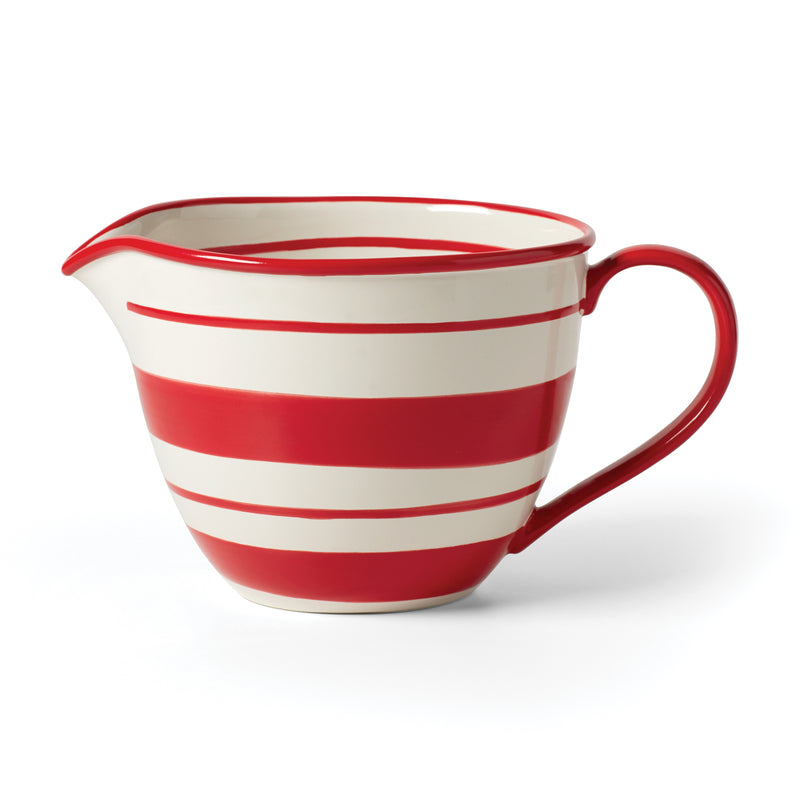 Holiday stripe batter bowl with red handle and curved spout, white base with red stripes