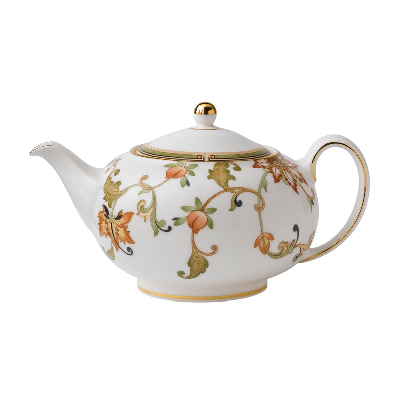 Porcelain teapot with ornate gold trim and floral vine pattern, curved spout and handle.