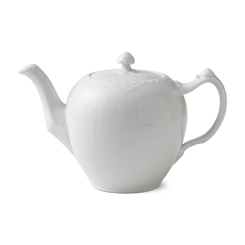 White fluted porcelain teapot with lid knob and curved side handle