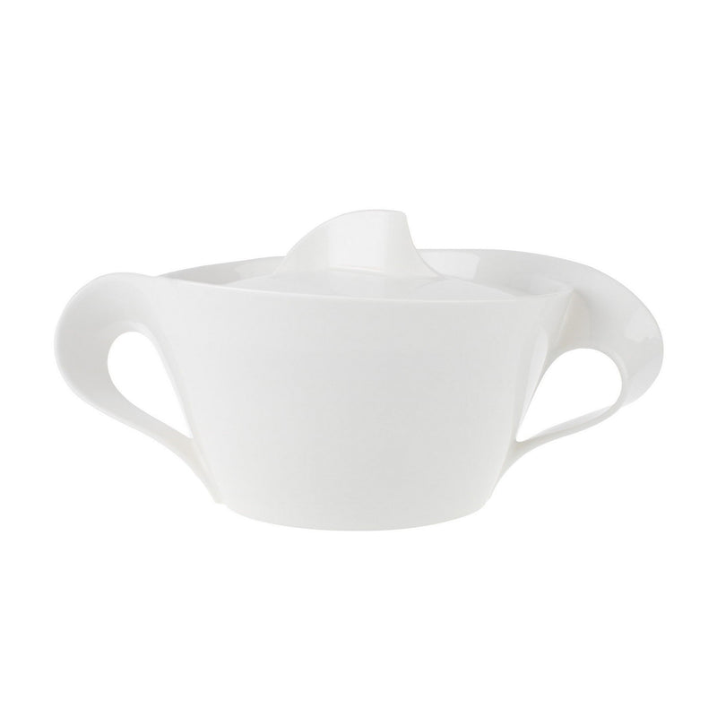 White porcelain covered vegetable bowl with curved handles and matching lid