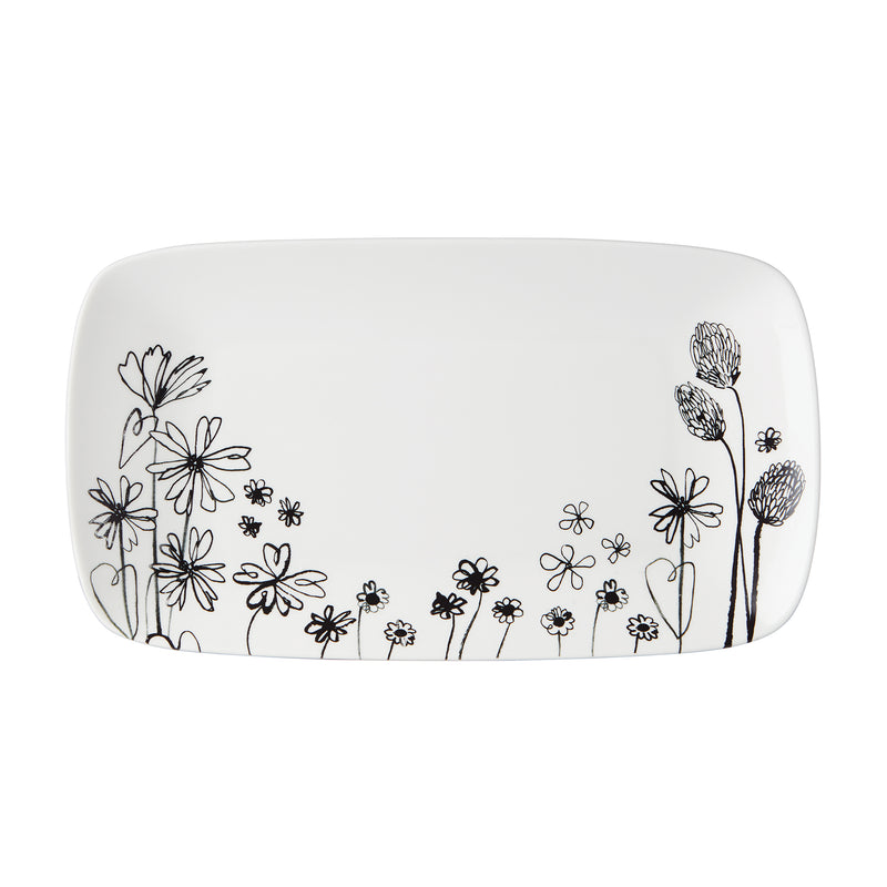 Porcelain serving tray with black floral doodle on white background