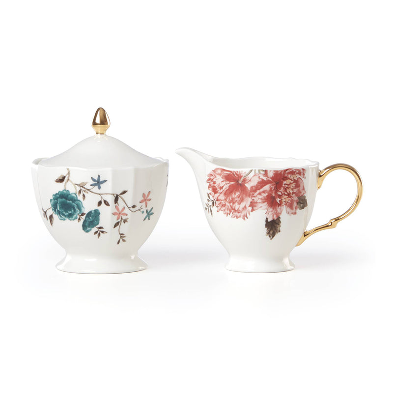 Lenox porcelain sugar and creamer set with floral sprig design, gold handles and finial