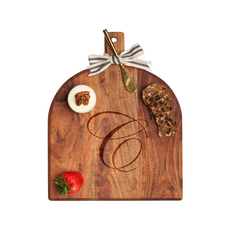 Acacia wood serving board with top handle and engraved initial, rounded shape