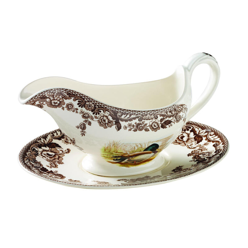 Spode Woodland porcelain sauce boat with matching dish stand, bird and floral motif.