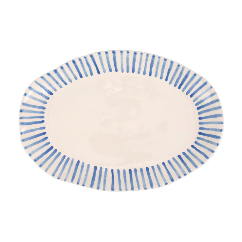 Oval ceramic serving platter with blue stripe rim and off-white center