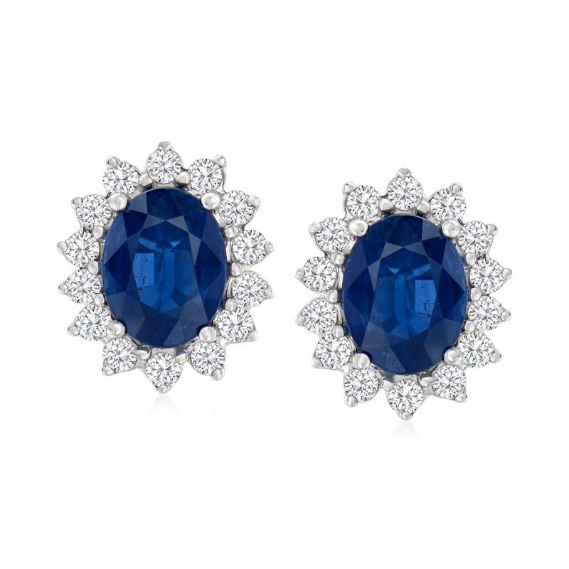 Blue oval sapphire and diamond halo stud earrings in 14kt white gold