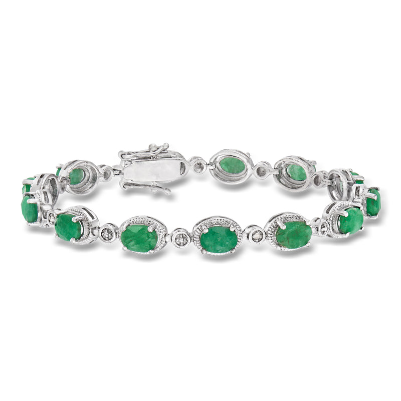 Sterling silver emerald bracelet with oval green stones and diamond accents, clasp