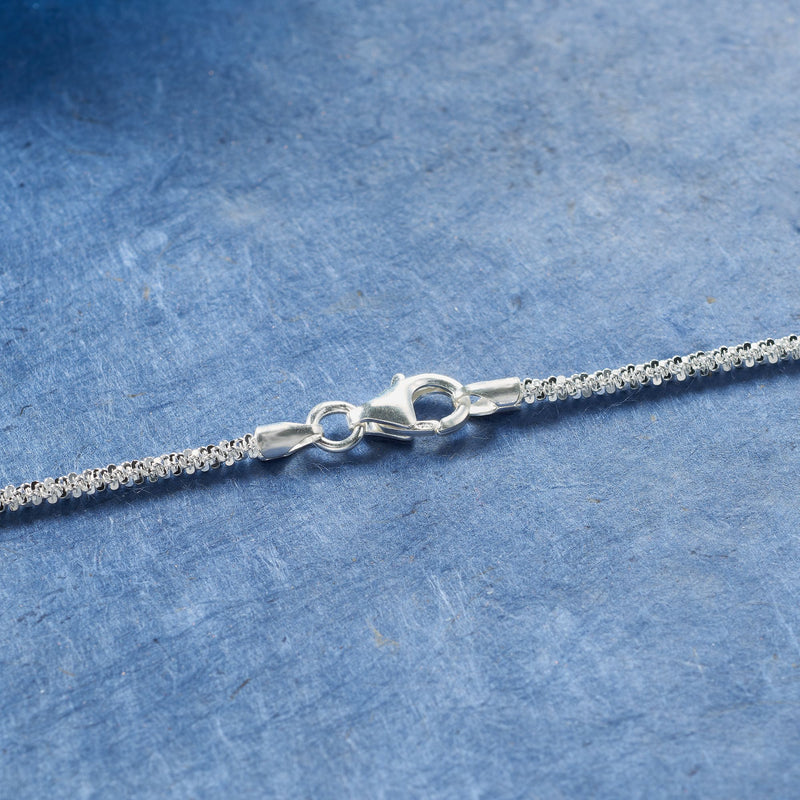 Sterling silver crisscross-chain necklace clasp and link detail