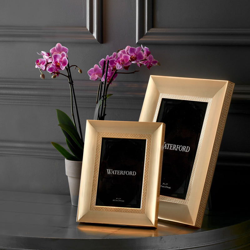 Goldtone Waterford photo frame with diamond-pattern border and black inner photo mat