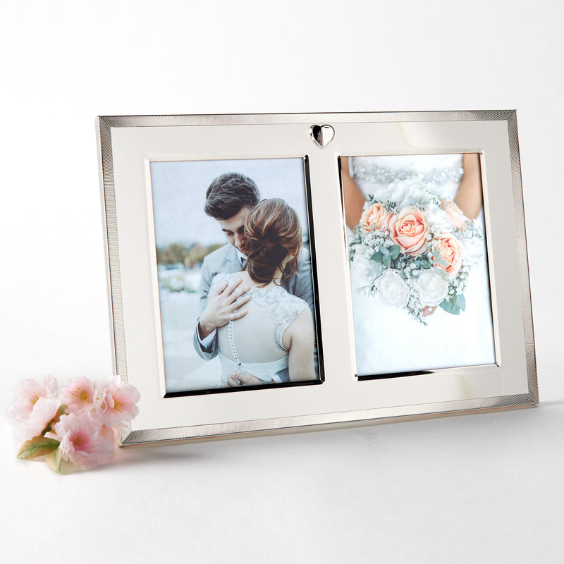 Double photo frame with two openings and heart emblem, silver finish