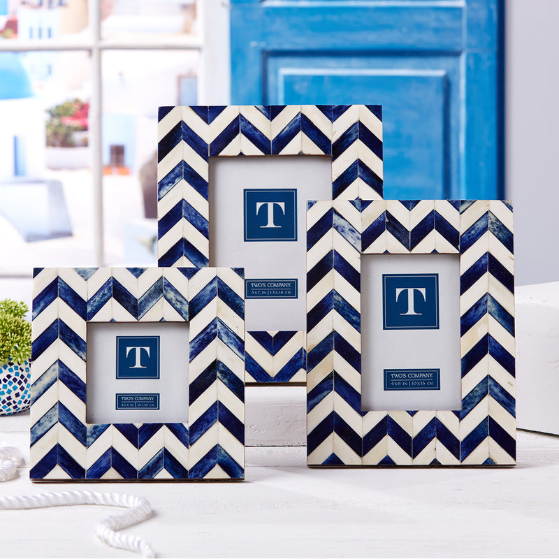 Set of three chevron photo frames with navy-and-white zigzag borders, rectangular.