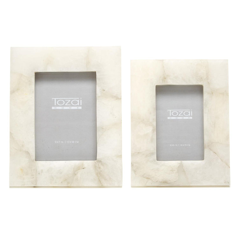 Set of two white quartz photo frames with gray inner photo openings, wall display