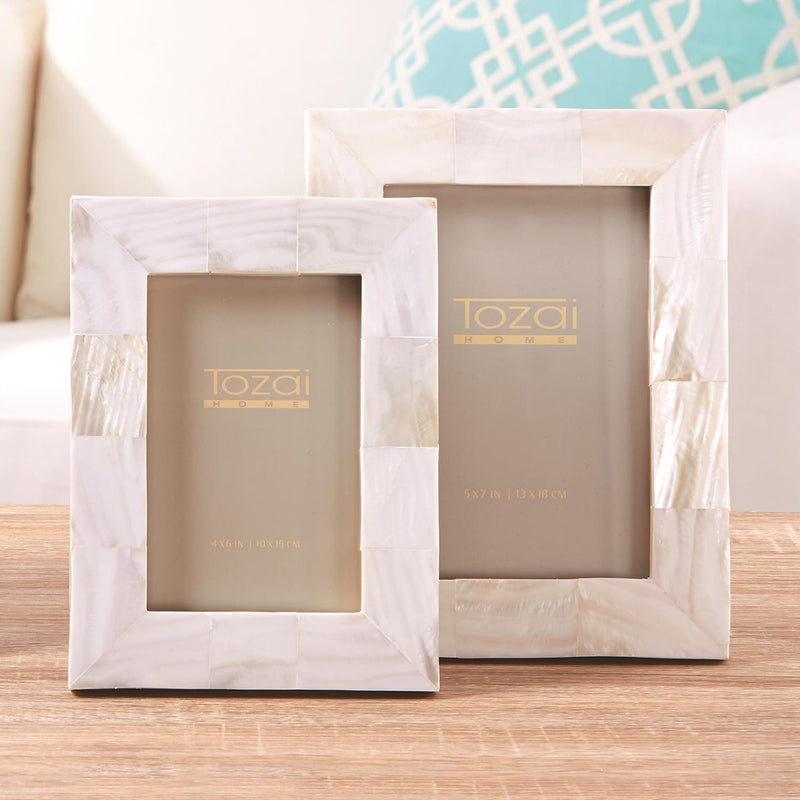 Set of two white mother-of-pearl photo frames with protective glass fronts