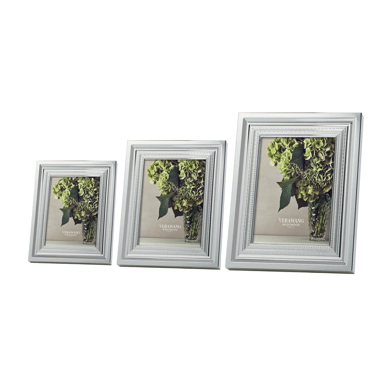 Silver plate picture frames with ornate border, three-piece set