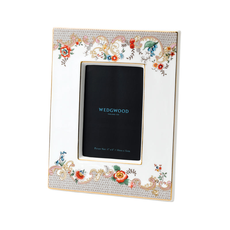 Wedgwood rococo floral 4x6 frame with white border and ornate flowers, holding a dark photo