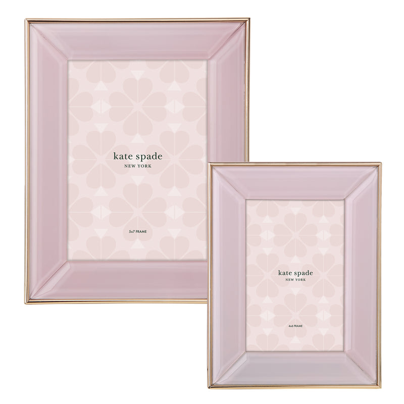 Blush picture frame with gold trim, heart-pattern mat, and kate spade branding