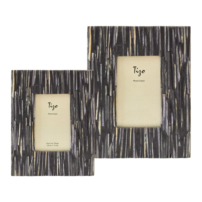 Gray and black faux bone picture frames with cream inner mat and Tizo label