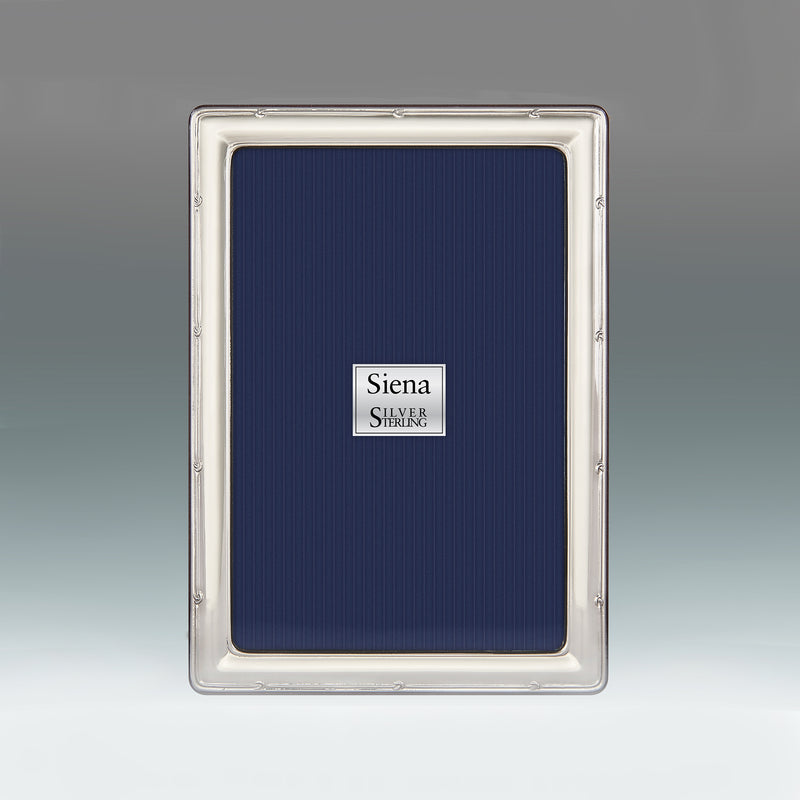Sterling silver picture frame with ornate knot border, flat front view