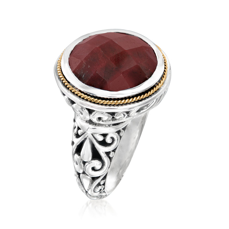 Sterling silver Bali-style ring with oval ruby stone, ornate side engravings, gold edge