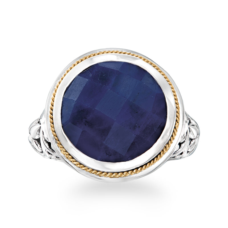 Bali-style sapphire ring with oval dark blue stone, sterling silver and gold rope halo