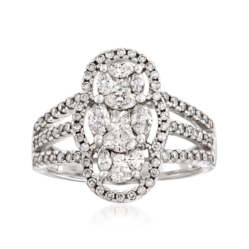 Three-stone diamond ring in 14kt white gold with oval center and diamond halo
