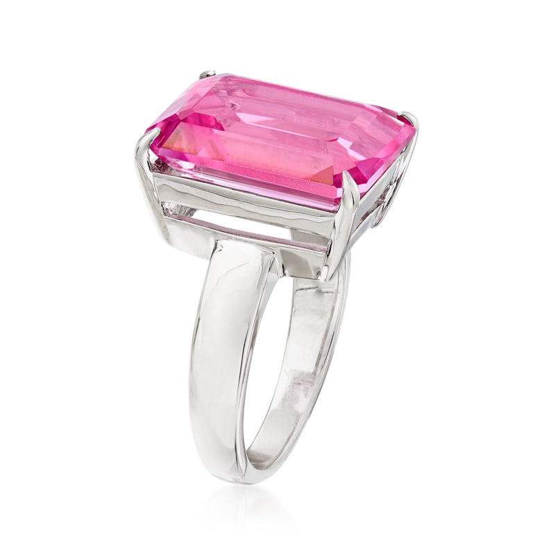 Sterling silver ring with emerald-cut pink topaz, angled side view