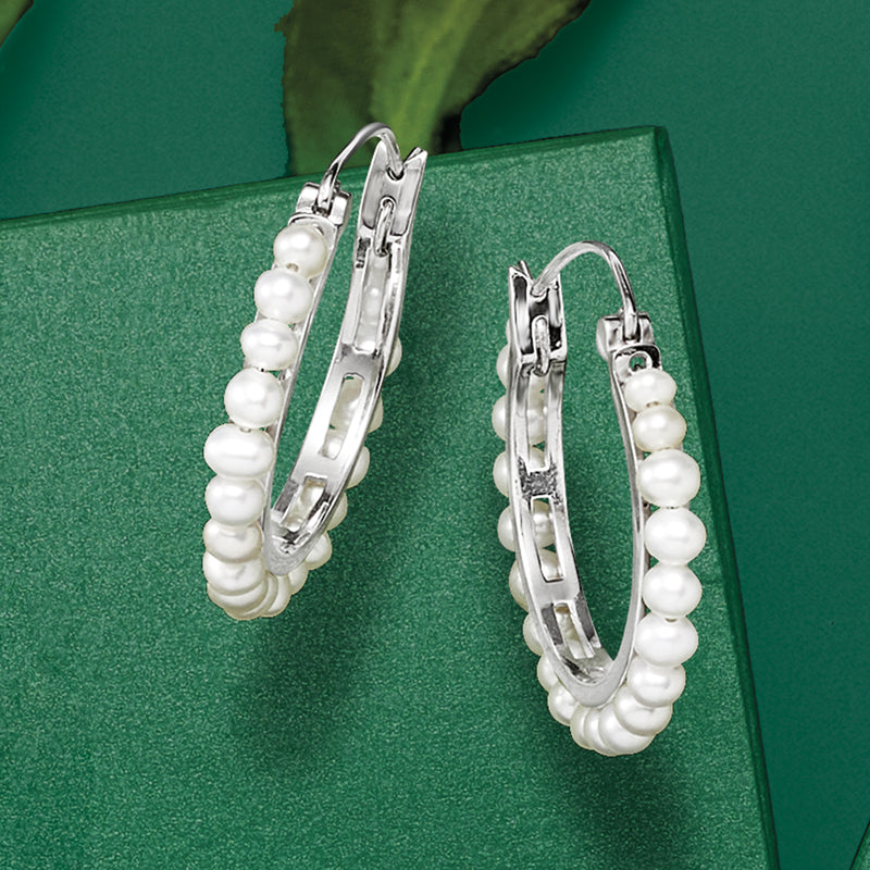 Sterling silver hoop earrings with cultured pearls and visible hinge hardware