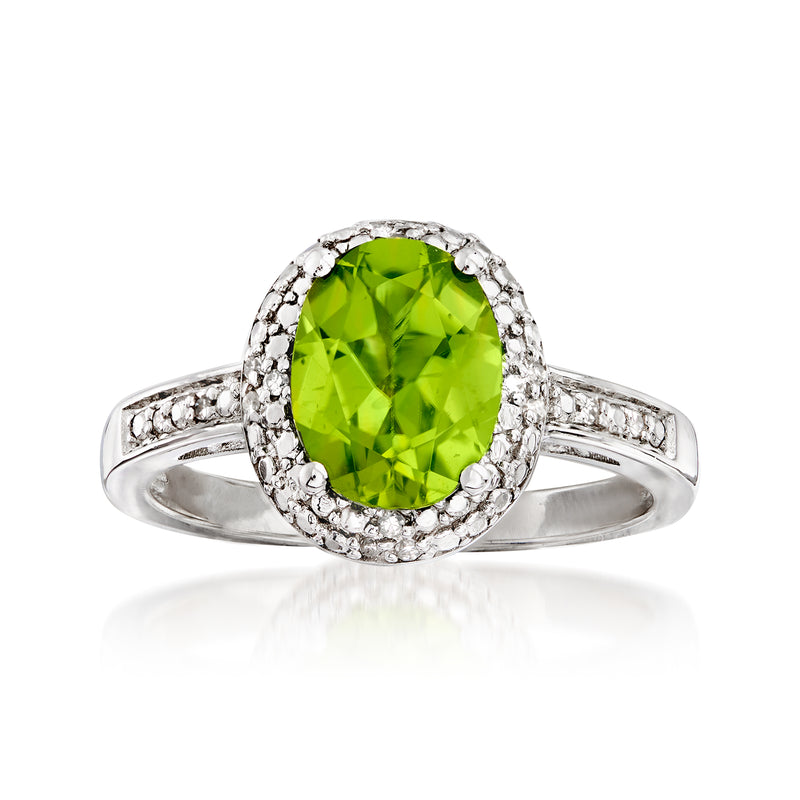 Sterling silver peridot ring with halo of small diamonds and curved band