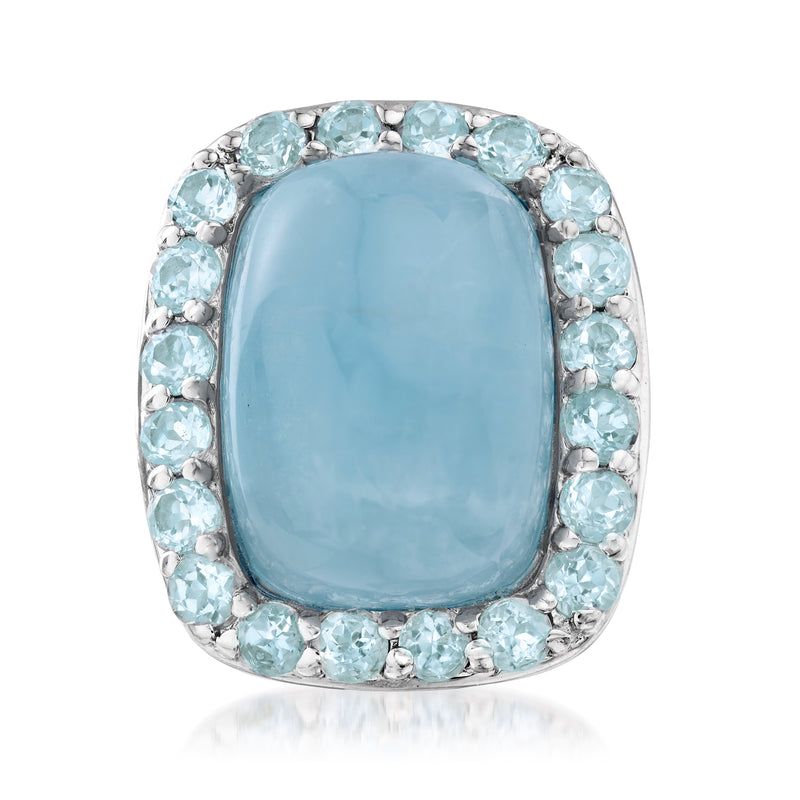 Sterling silver ring with oval sky-blue center stone and light-blue halo accents