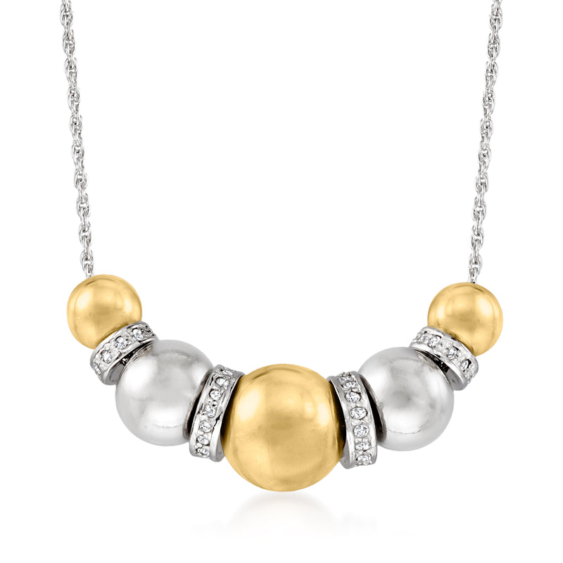 Bead necklace with silver chain, gold and silver beads, and small diamond accents