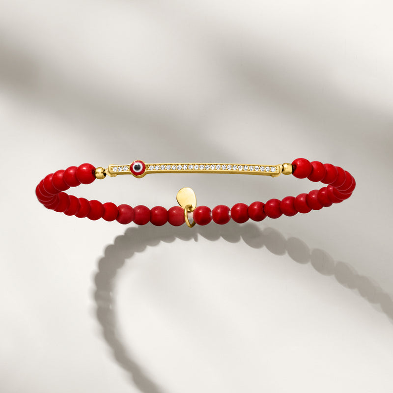 Red coral bead stretch bracelet with gold-tone evil-eye enamel and CZ row bar